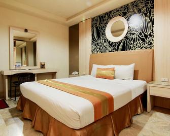 Hotel Grand Rosela - Yogyakarta - Bedroom
