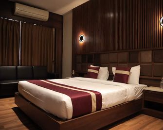Vivotel Hotel Surat - Surat - Schlafzimmer