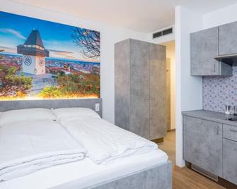 Arbio I Urbanstay Serviced Studios & Apartments - Graz - Bedroom