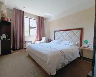 Jin Niu Business Hotel - Mianyang - Bedroom