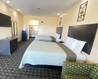 Homegate Inn and Suites - West Memphis - Schlafzimmer