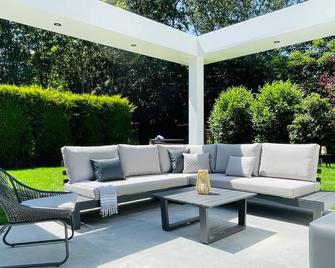 Dune villa in Ouddorp at the sea for 8 pers. with hottub and trampoline. - Ouddorp - Innenhof