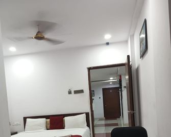 Hotel New Mythri Inn - Haiderabad - Slaapkamer