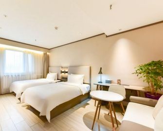 Hanting Hotel Xining Haihu New District Wanda Plaza Xi Store - Xining - Bedroom