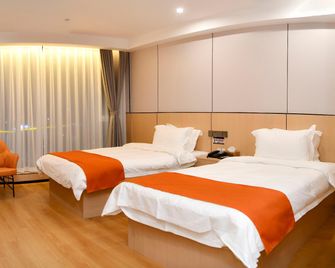 Linyi Baihong Jintang Business Hotel - Linyi - Bedroom