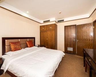 Sanguo Hotel Hanzhong - Hanzhong - Спальня