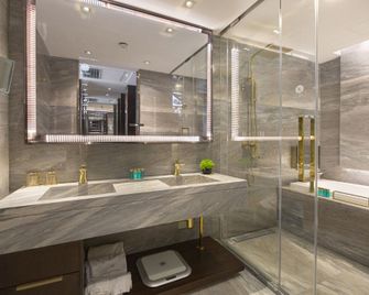 يو هوتلز - تشينغداو - غرفة نوم