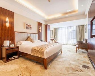 Jiusheng International Hotel - Gannan - Bedroom