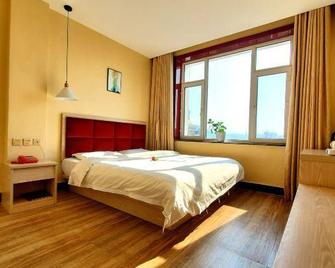 Tiandiyuan Hotel (Baishan Railway Station Passenger Transport Terminal Shop) - Baishan - Bedroom