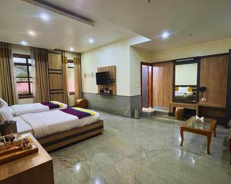 Dichang Resorts - Guwahati - Bedroom