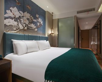 Bailan Hotel (Tonggang Road Branch, Dagang New District, Zhenjiang) - Zhenjiang - Bedroom