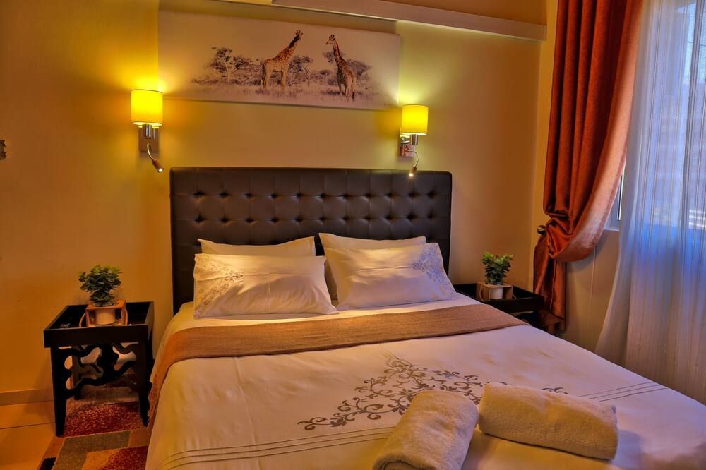 Tillas Guesthouse - ווינדהוק - חדר שינה