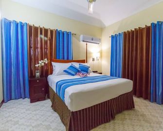 Jasmine Inn - Kingston - Bedroom