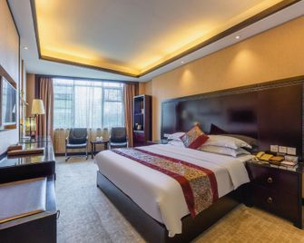 Wuyuan Ruiyi Xingjiangwan Holiday Hotel (Zhuzi Pedestrian Street) - Shangrao - Bedroom