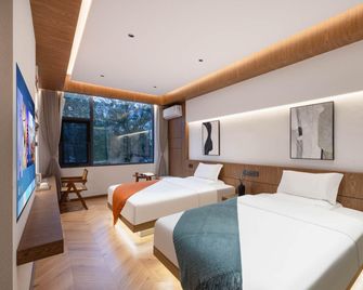 Waiting for the Wind Luxury Hotel (Dahuaqiao Park Branch) - Qujing - Bedroom