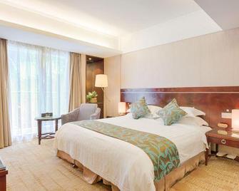 Shi Long Hotel - Dongguan - Schlafzimmer
