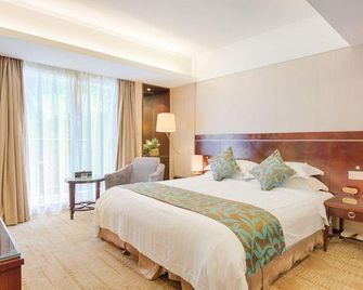 Shi Long Hotel - Dongguan - Спальня