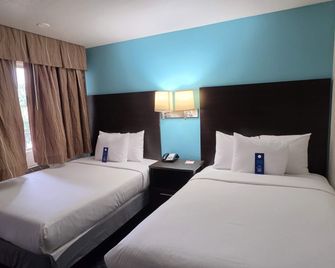 Howard Johnson by Wyndham Odessa TX - Odessa - Bedroom