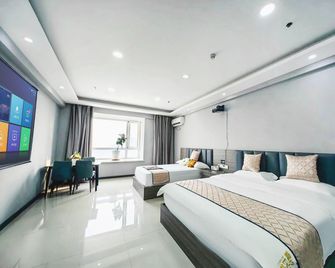 There is a guesthouse (Antong Old Street Branch) - Dandong - Schlafzimmer