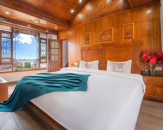 Yuxue Qingcheng · Xinyi Mountain Scenic Style Oxygen Bar Manor (Wangulou Store) - Lijiang - Camera da letto