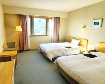 Island Hotel - Nagano - Camera da letto