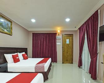 OYO 90642 Twin Mutiara Chalet &homestay - Tanah Merah - Bedroom