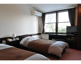 Hotel De Winds - Chino - Schlafzimmer