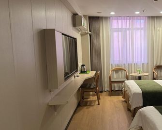 Vatica Hotel Tianjin Dagang Xuefu Road University Town - Tiençin - Yatak Odası