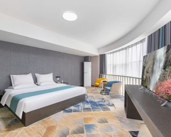 Zhongzhou Exquisite Hotel (Jiaozuo High-speed Railway Station Store) - Jiaozuo - Slaapkamer