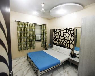 Hotel Al Madina - Mumbai - Schlafzimmer