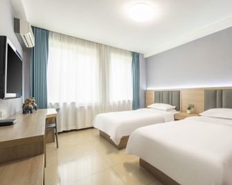 Jingyuan Collection Hotel (Fengzhou Road Wanda Plaza) - هوهيهوت - غرفة نوم