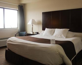 Cobblestone Inn & Suites - Denison | Oak Ridge - Denison - Schlafzimmer