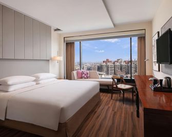 رينيزانس أحمد أباد إس جي هايواي - أحمد أباد - غرفة نوم