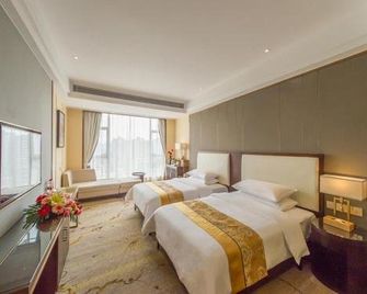 Vienna International Hotel Diecai Wanda - גילין - חדר שינה