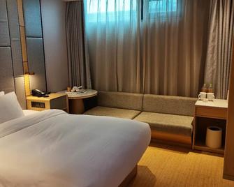Ji Hotel Qufu Visitor Center - Jining - Bedroom