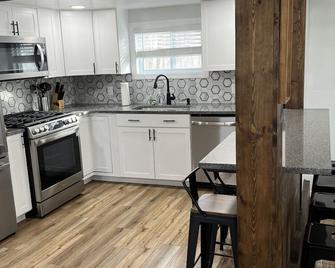 Joe’s Bungalow Beach House- Sunset Vacation Rentals - Geneva - Kitchen