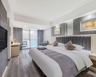 Anqing Mingjia Hotel - Anqing - Bedroom