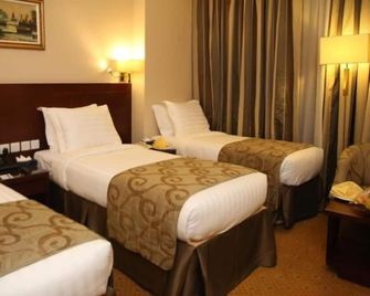 Al Aqeeq Al Rawda Hotel by Abu Al Joud - Medina - Bedroom