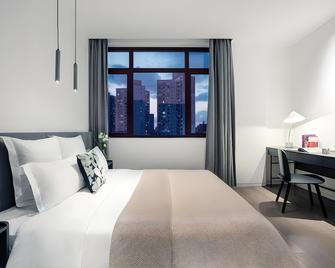 Base-Pusan Serviced Apartment -Shanghai New International Expo Centre - Shanghai - Camera da letto