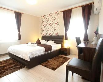 Pension Mora - קלוז'-נאפוקה - חדר שינה