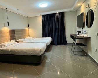 Ivory Park Hotel - Nakuru - Schlafzimmer