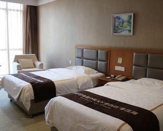 Huaxi Garden Hotel (Qingdao Liuting Airport) - Qingdao - Bedroom