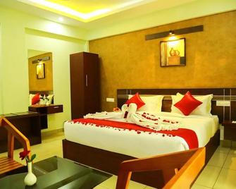 Akan Hotels & Residence - Meppādi - Habitación