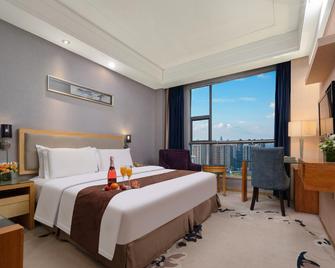 Xiangyang Hechi Shang Pin Hotel - Ксіанфан - Спальня
