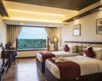 Kpm Tripenta Hotel - Kozhikode - Bedroom