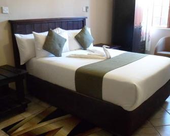 Kamore Guest Inn - Gumare - Habitación