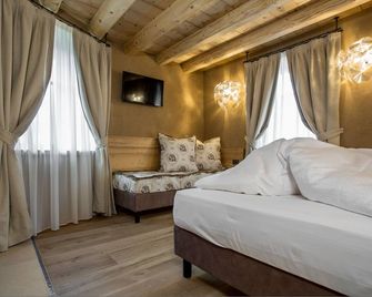 Hotel Orso Grigio - קאבאלסה - חדר שינה