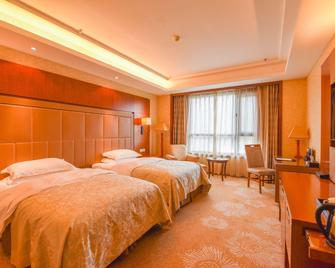 Wusong Hotel - Jilin - Camera da letto