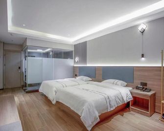 Next Wisdom Hotel - Wanning - Bedroom