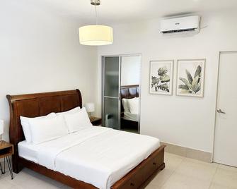 Harman Suites Moalboal - Moalboal - Спальня